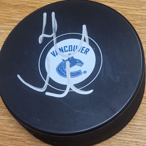 Autographed HENRIK SEDIN Vancouver Canucks Hockey Puck