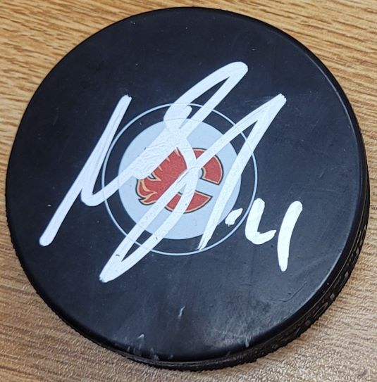 Autographed MIKAEL BACKLUND Calgary Flames Hockey Puck