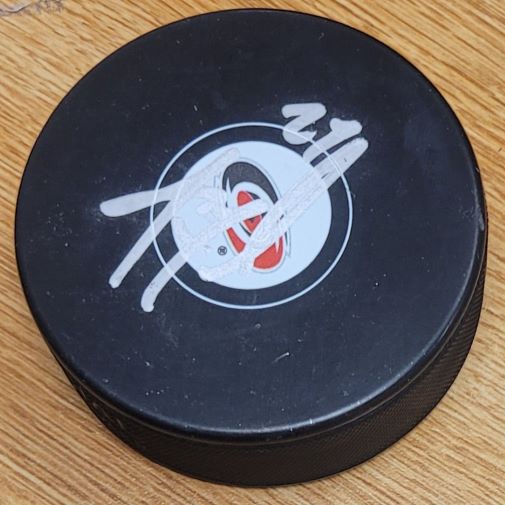 Autographed JUSTIN FAULK Carolina Hurricanes Hockey Puck