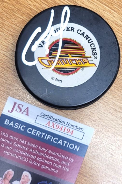 Autographed CAM NEELY Vancouver Canucks Hockey Puck JSA