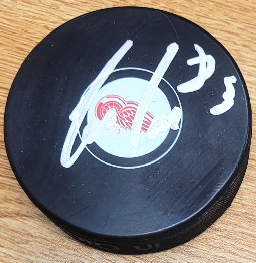 Autographed TREVOR DALEY Detroit Red Wings Hockey Puck