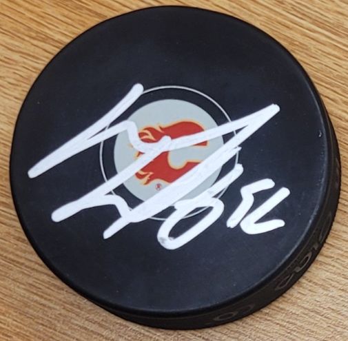 Autographed MACKENZIE WEEGAR Calgary Flames Hockey Puck
