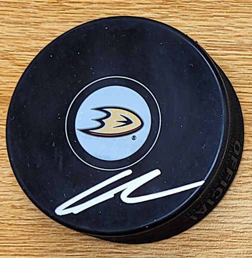 Autographed LEO CARLSON Anaheim Ducks Hockey Puck