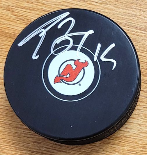 Autographed TRAVIS ZAJAC New Jersey Devils Hockey Puck
