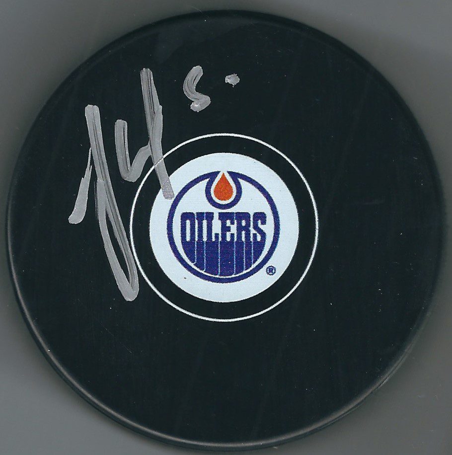 Autographed JONAS GUSTAVSSON Edmonton Oilers Hockey Puck