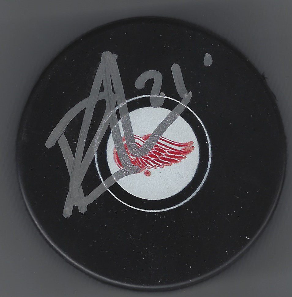 Autographed Dennis Cholowski Detroit Red Wings Hockey Puck